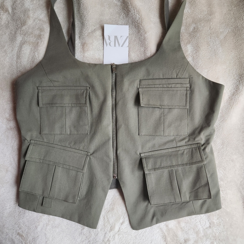 Zipper vest with front pockets vest top light khaki not Zara but very similar.